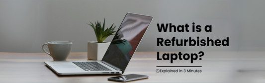 Laptop on a desk beside a coffee mug and plant with text overlay saying "What is a Refurbished Laptop? Explained in 3 Minutes